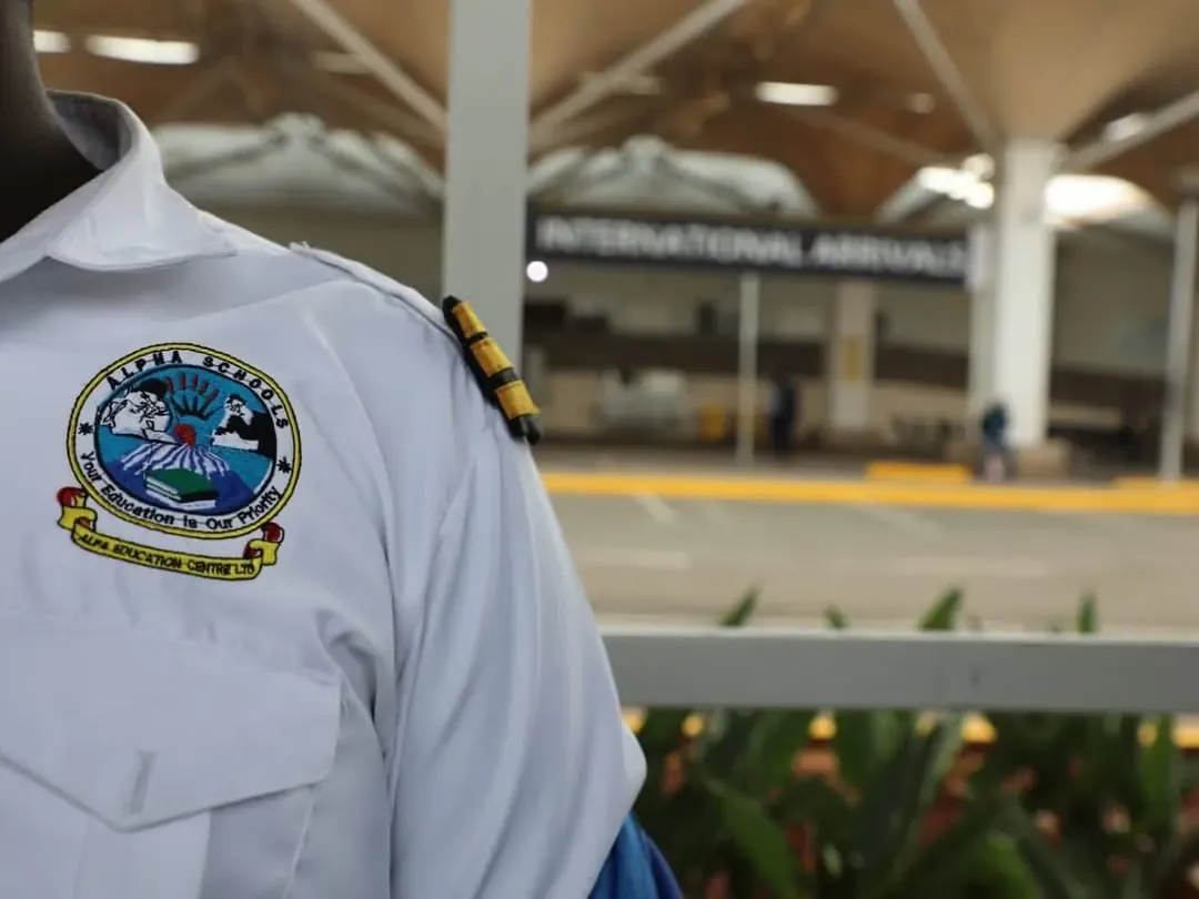 Alpha Schools aviation cadet in uniform at the airport