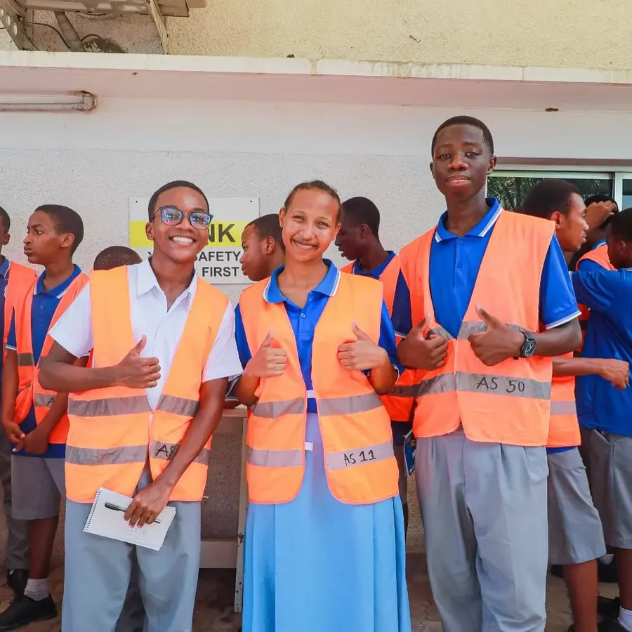 Alpha High aviation students in safety vests at JNIA
